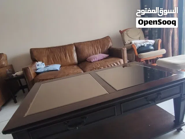 pure leather sofa and wooden center table