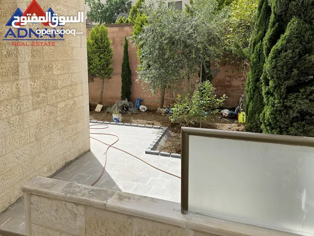 فرصة شراء شقة أرضية ( 100 ) % في عبدون مع حديقة وكراج خاص