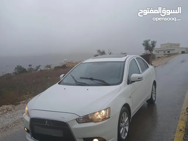 ميتسوبيشي لانسر. 2015 اصل برايفت   رخصة وتامين  ماطور 1600 اتومات  شامل  فتحة   اماكنية لبيع نص بنص