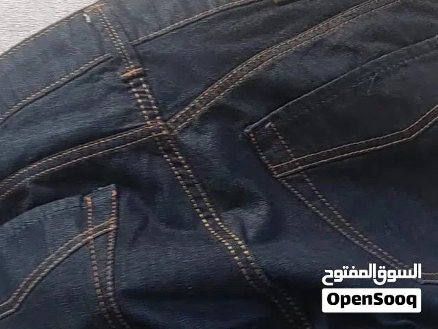 بنطلون جينز ازرق غامق