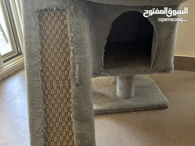 Cat tree with plush perch and scratching post.
