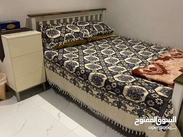 Queen size bed with matters and 1 side table