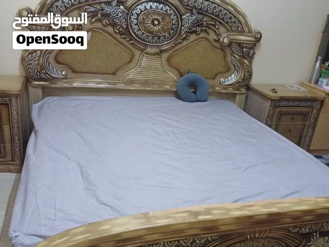 king size bed and dressing table with mattress and side tables