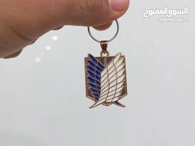 ميداليه مفاتيح شعار اتاك اون تايتن ذهبي