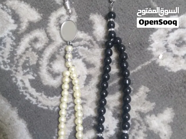 مسبحة الزبرجد احجار كريمه وزن 56 غرام ومسبحه لولي وزن 35غرام