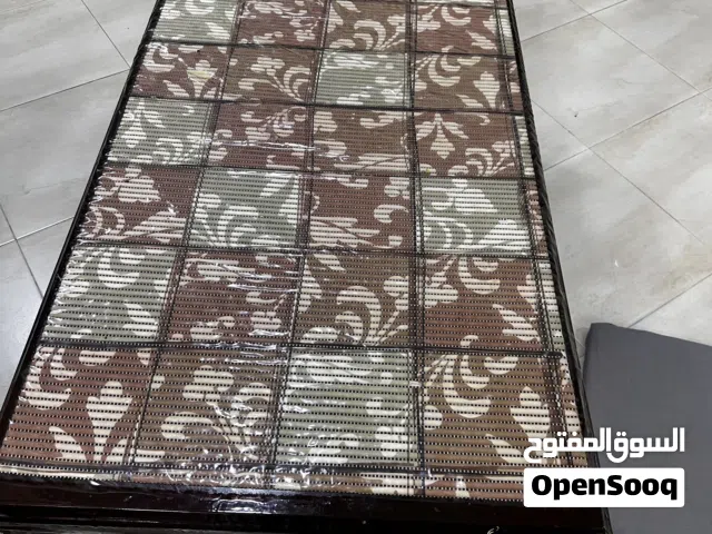 Dark brown table is for sale .