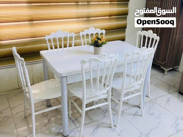 ميز  طعام  ارجل  حديد   كراسي عظم عاج