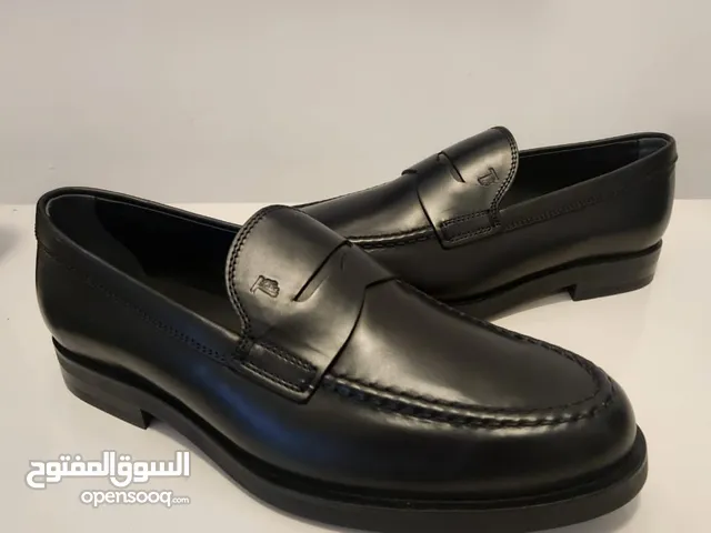 Tod’s Black Leather Penny Loafers