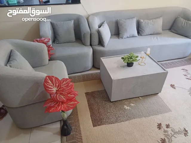 Expat selling Artistic Sofa Set (4+1+1) seats - Excellent Condition + center Table. 10/10 condition.