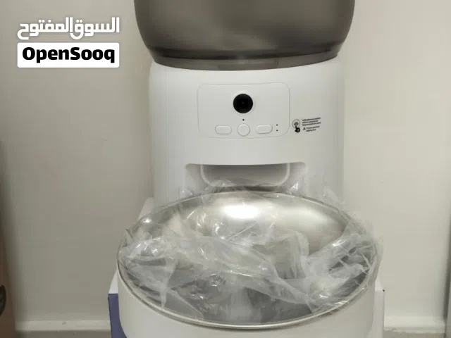 Barely used Cat food dispenser, and water fountain