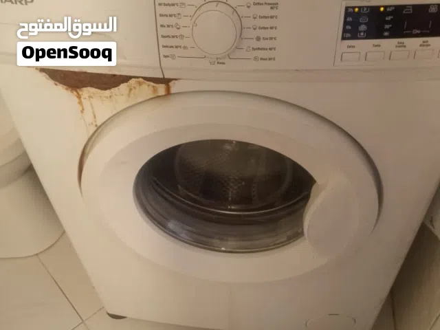 غساله اتوماتيك نوع شارب 7كيلو شغاله تمام وضعها كما هو موضح بل صورة عليها صدء. ع25 دينار