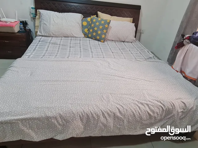 King size bed made from Italian wood brought from the United Arab Emirates.