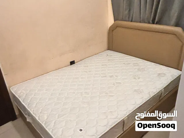 King bed frame with upholstered headboard, mattress