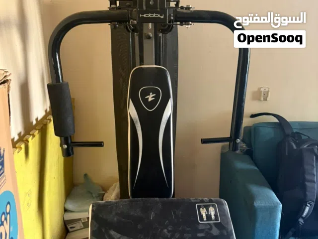 دراجه رياضيه معا جاهز وضنبل وبار  Exercise bike, machine, dumbbells, and bar