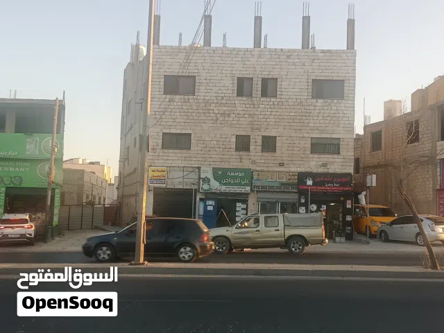 عمارة للبيع في ابوعلندة المستندة  على الشارع الرئيسي قرب دوار المستندة  ثلاث طوابق اربع مخازن