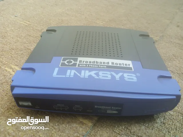 راوتر سيسكو-لينكسيس WRT55AG لاسلكي ثنائي النطاق A+G اكسس بوينت + كابل/دي اس ال مع 4 منافذ