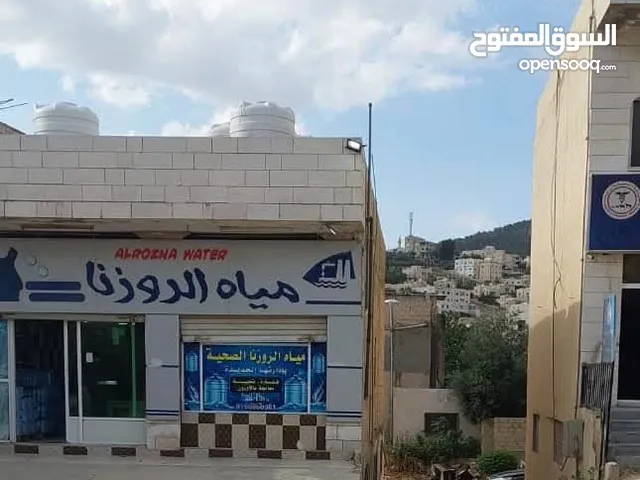 طابق ارضي تجاري ومحل بنفس المجمع للايجار