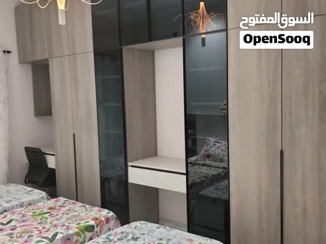 تفصيل جميع الاعمال الخشبيه دواليب خزائن ابواب ديكورات تلفزيون والسلالم الخشبيه والمطابخ