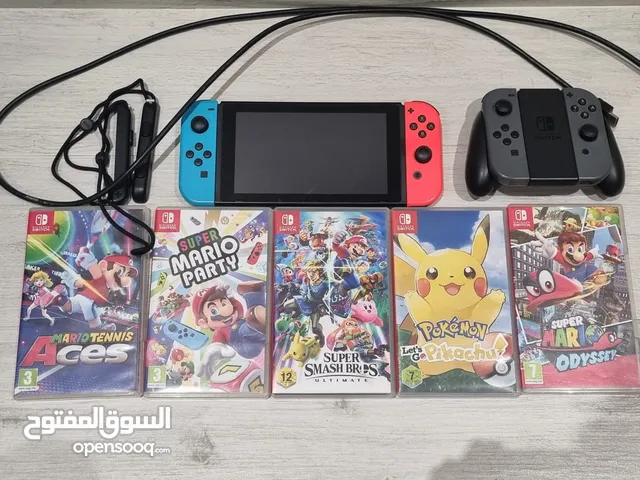 Nintendo Switch + 2 controllers + 5 Games + Joy-Con Charging Grip ( no charger no chargin dock )