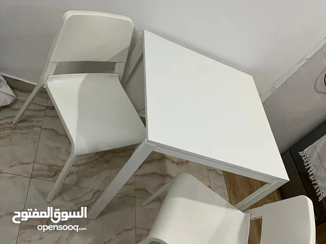 Sleek White Dining Table with Chairs - Perfect for Minimalist Spaces!