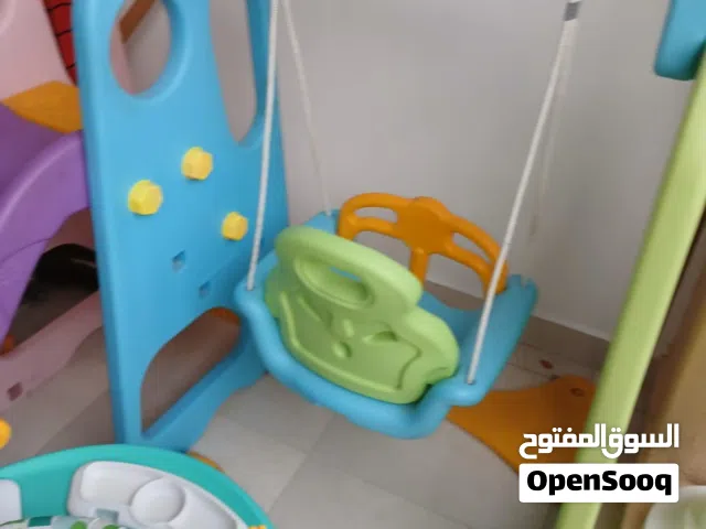 ارجوحه مع زحلوقه  شبه جديده  هزازي للاطفال مع العاب شبه جديد