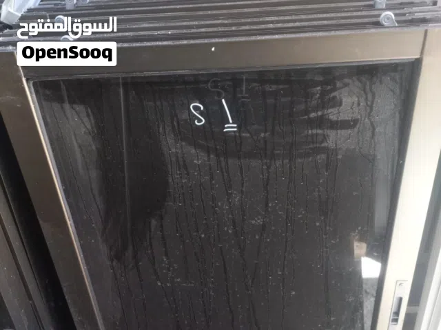 شبابيك المنيوم مستعمل لون شمبيه زجاج عسلي بحال الوكاله