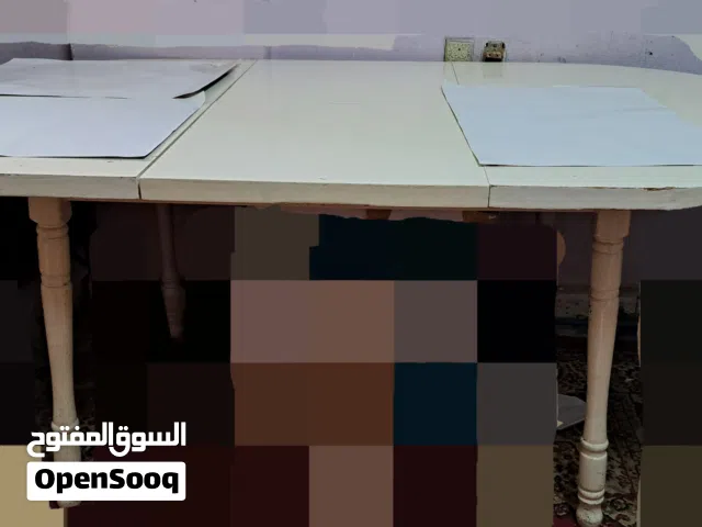 Convertible oval shape dining table