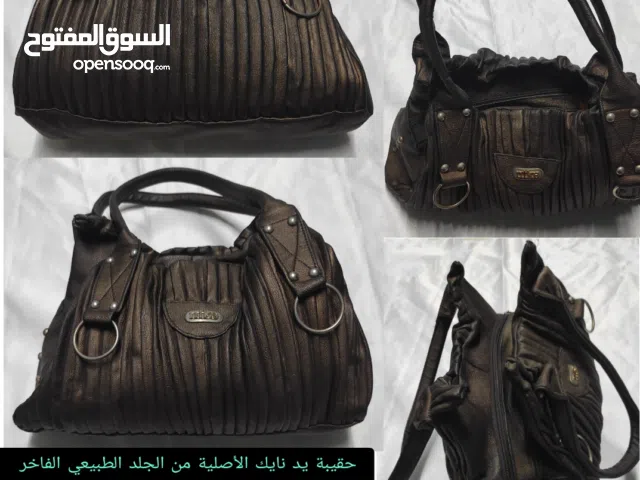 حقيبة يد نايك الأصلية من الجلد الطبيعي الفاخر بتصميم الكسرات اليدوية النادر ولون برونزي ميتاليك ساحر