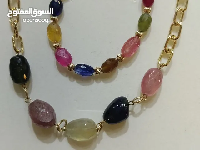 Handmade jewelry precious colored stones and semiprecious stones. fresh water pearls