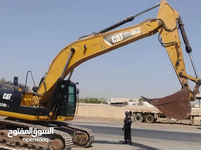 cat excavator and volvo primemover