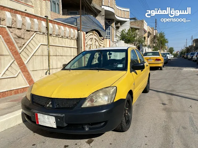 متسيبوشي لانسر 2010 اصفر