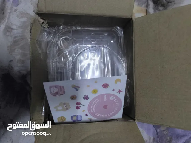 للبيع – حافظ Instax Mini 12 شفاف مع ستيكرات وحبل تعليق جديد ولم يُستخدم
