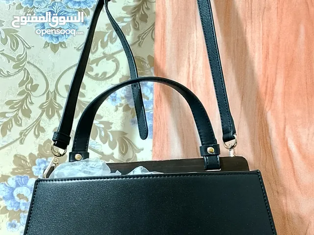 2 bags original preloved no scratch  guess and Charles Keith
