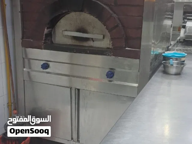 فرن حجري و عكاز و رقاقة عجنين