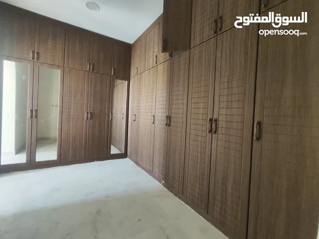 Large brown wooden built-in wardrobe with mirror for sale