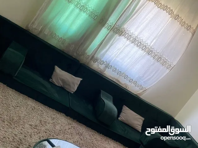 قعدة عربية مع مساندها + سجادة + برداي تتكون من 5 فرشات لون زيتي شبه جديد