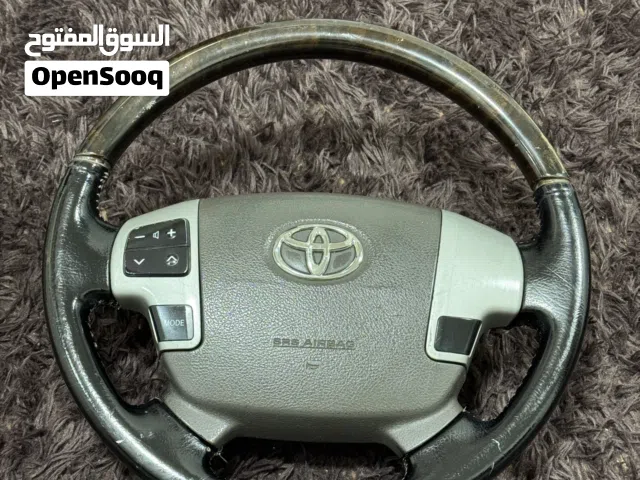 طارة Toyota أصلي جلد + خشب مع أزرار تحكم – حالة ممتازة