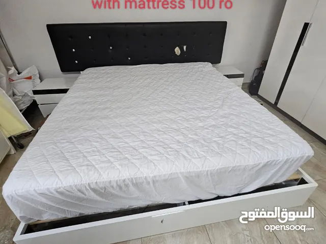 king size bed with mattress and 2 comod
