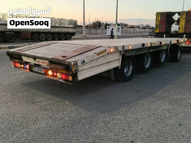 مقطورة للبيع اربع محاور عريش قائم 30 طن دناجل 12 pp طابات صفة الاستعمال ناقلة سيارات ويمكن تغير صفة