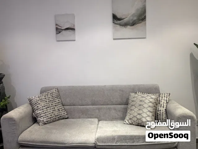 Complete living room furniture set, including sofas, a coffee table, and guest chairs.