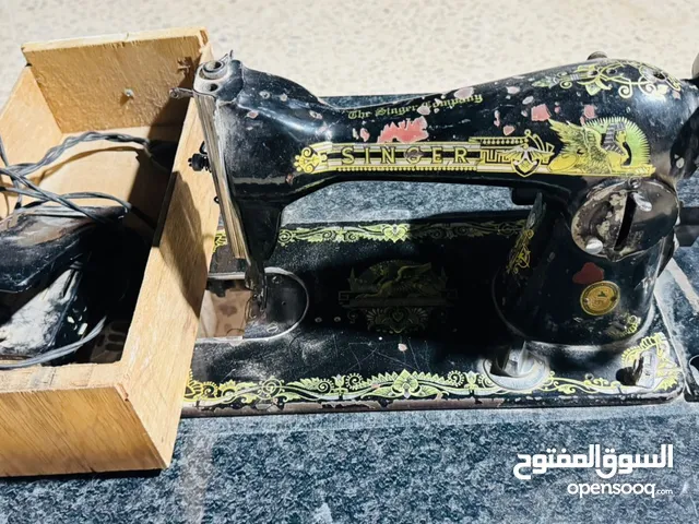 ماكينة خياطة singer المعروفة مع كرسي خاص