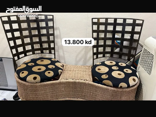 Two chairs attached to the wooden net and a 4 drawer for sale the chairs round also