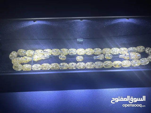 كهرمان اصلي مع رقائق الذهب