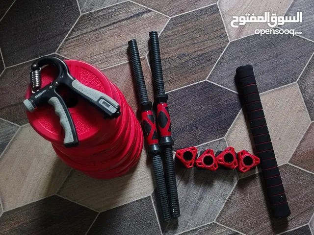 دمبلصين كل واحد عشر كيلوات (عشرين كيلو) وقبضة مقاومة 60 كيلو