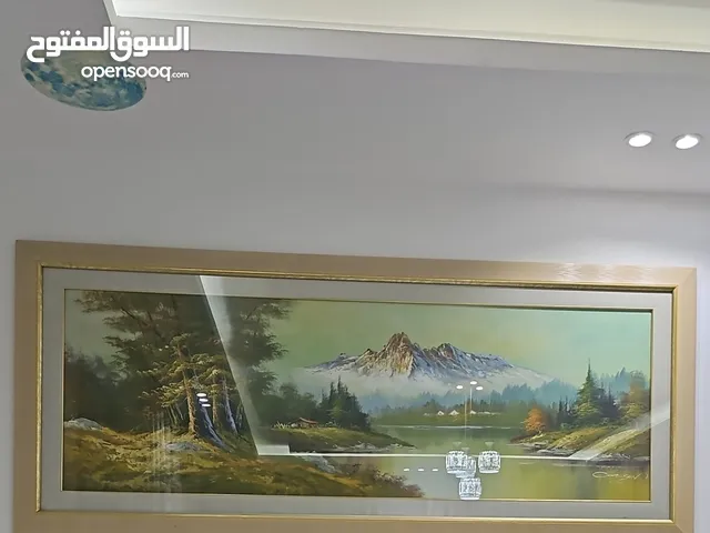 Wall paintings.. Good.. Wall accessory.. Decor.. A parity, Photos on the table