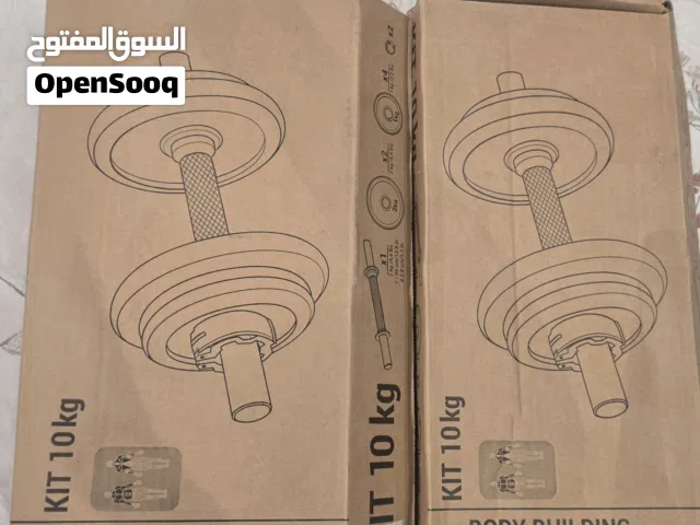 أوزان 20 كيلو من ديكاثلون + 2 بار صغير + 2 بار كبير + عجلة تمارين البطن 20 k. weight plates & bars