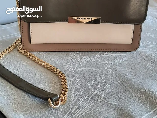 شنط مايكل كورس و فوسل