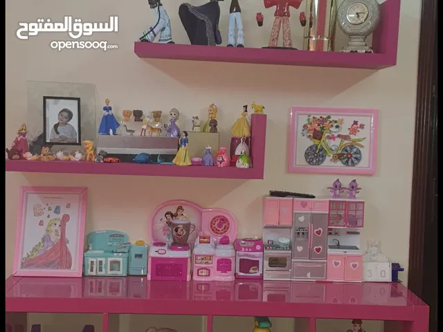 doll house and pink shelfs and bookcase plus toys