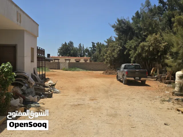 تم تخفيظ السعر ارض1500م فى بوعطني حي الزهور بها منزل