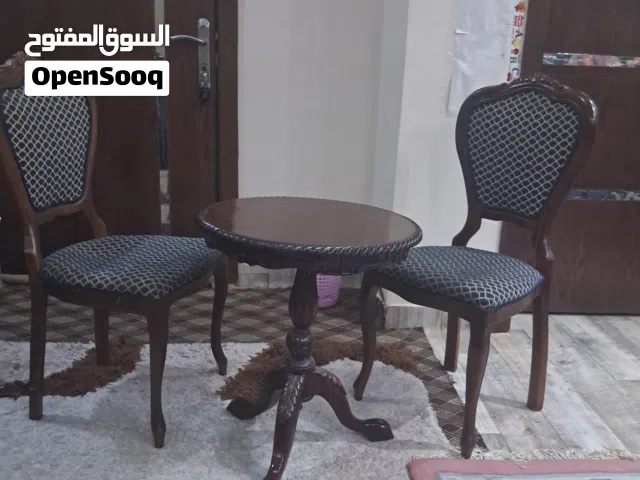 طاولة انتيك مع كرسيين + مساند + سجاد + دفاية + طاولات + سرير اطفال